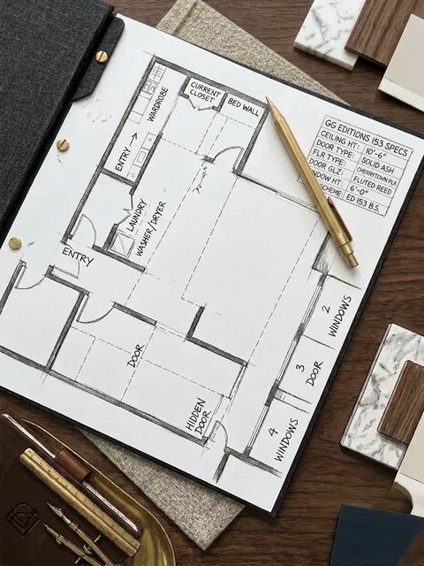 A hand-drawn plan with its specification block, drawn over a bound G&G Editions volume