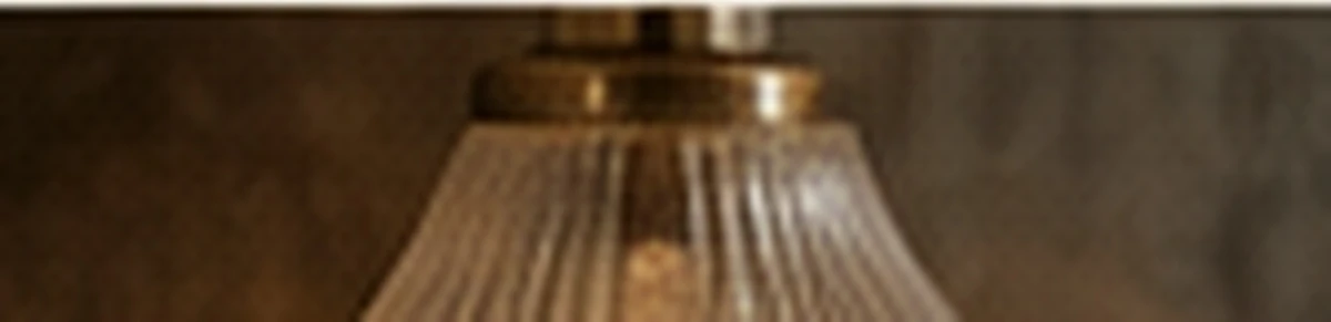 Ribbed glass and bronze fixture detail &mdash; Light